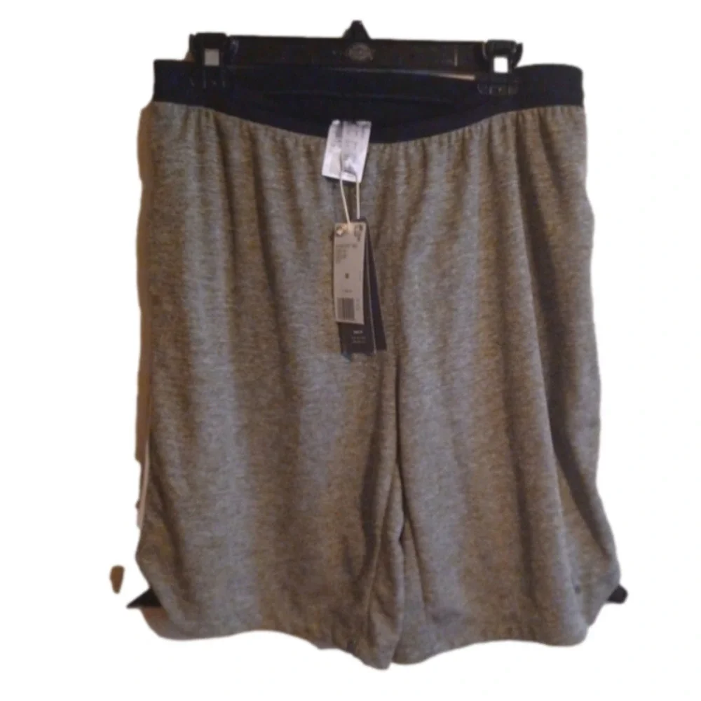 NWT   Adidas knit Grey shorts. Black waist band, white stripes. Size medium.